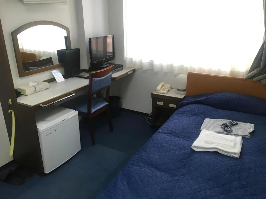 Bed in Tokyo Business Hotel