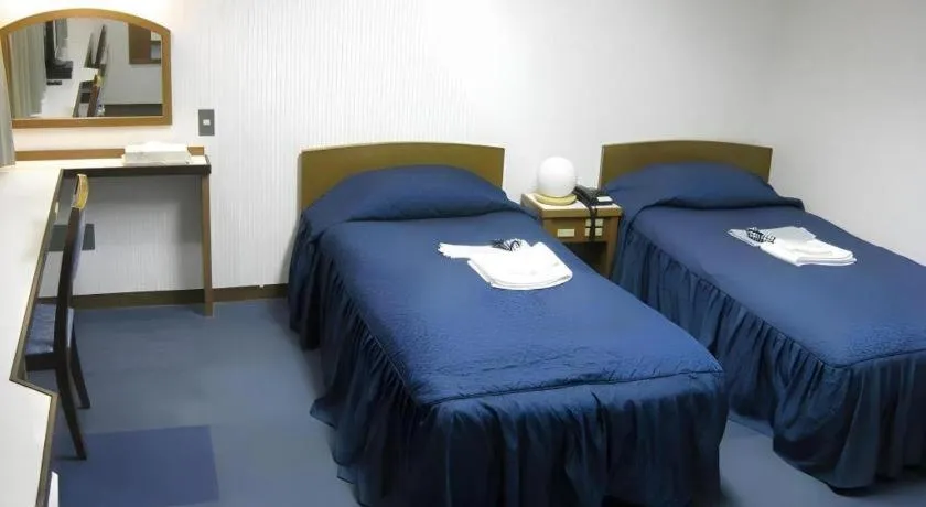 Bed in Tokyo Business Hotel