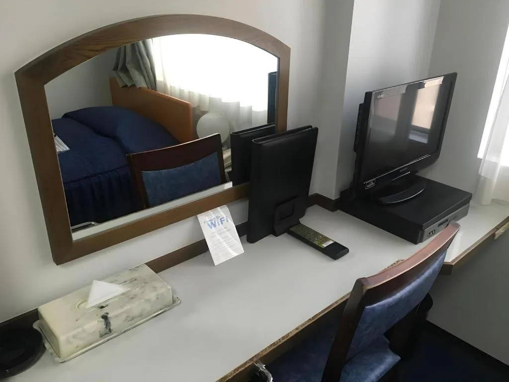 Bed in Tokyo Business Hotel