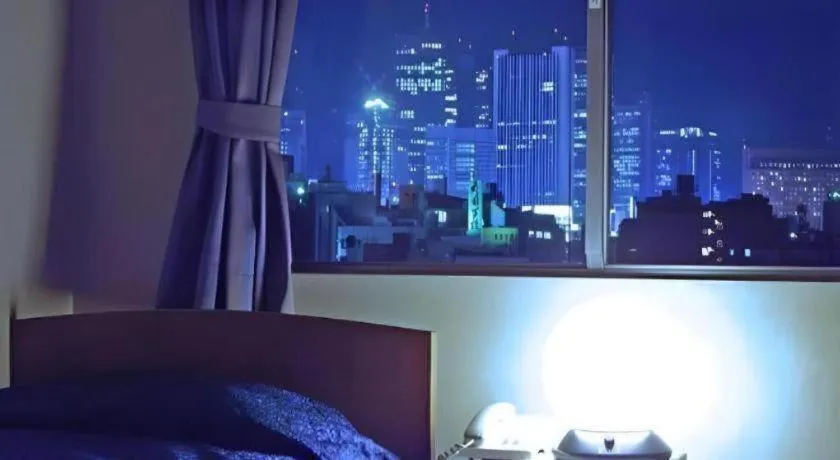 Bed in Tokyo Business Hotel