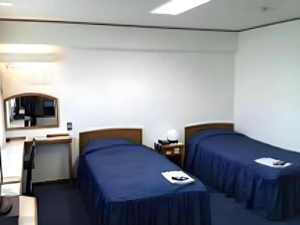 Bed in Tokyo Business Hotel