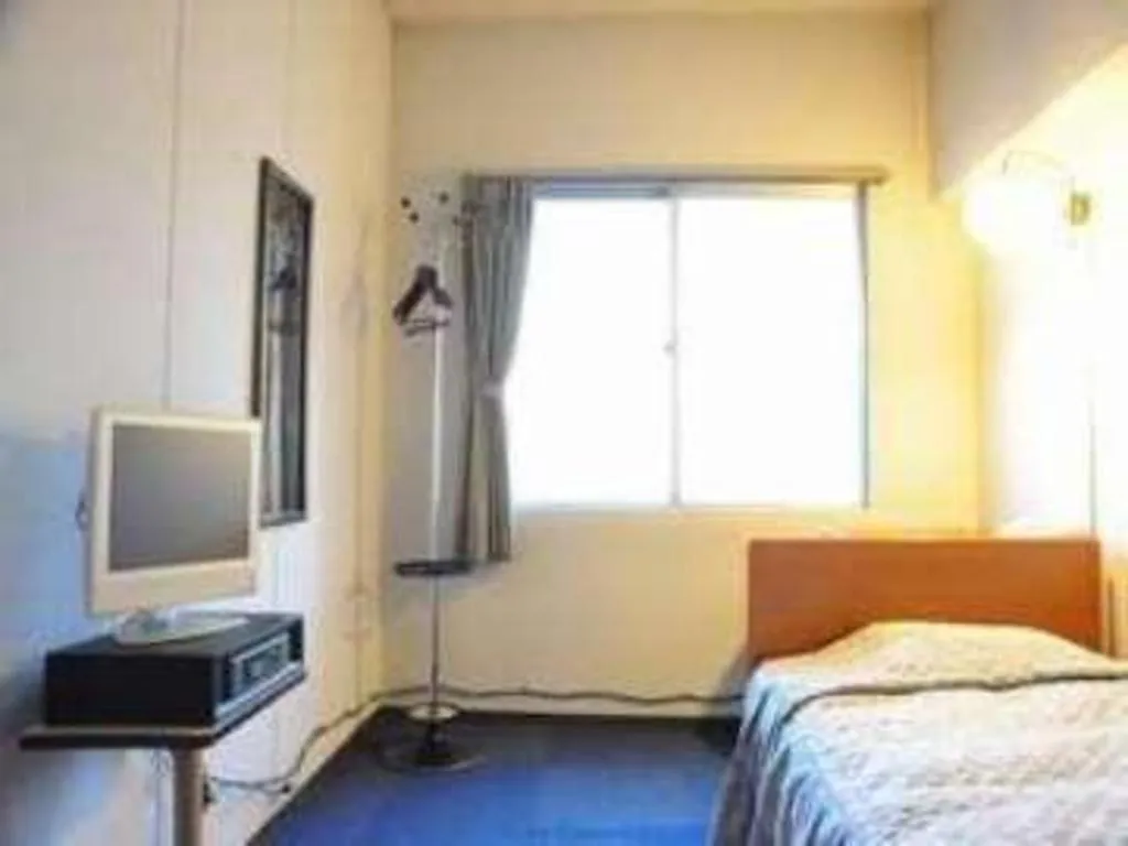 Bed in Tokyo Business Hotel