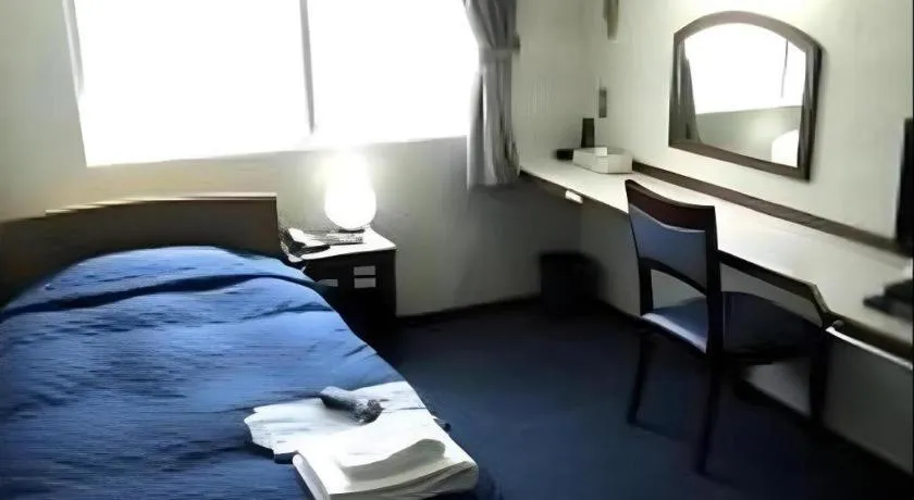 Bed in Tokyo Business Hotel