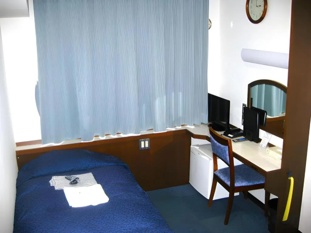 Bed in Tokyo Business Hotel