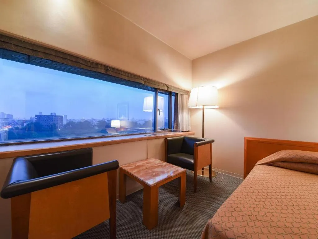 Bed in Gunma Royal Hotel