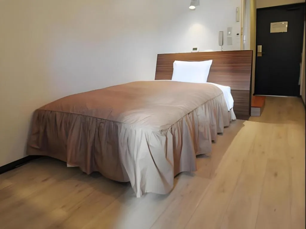 Bed in Hotel Tetora Tsurumi