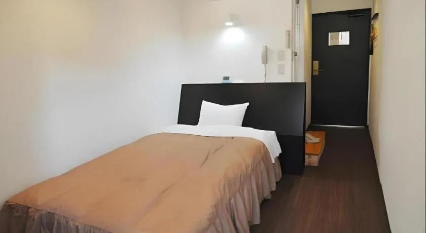 Bed in Hotel Tetora Tsurumi