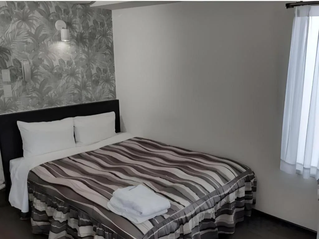 Bed in Hotel Tetora Tsurumi