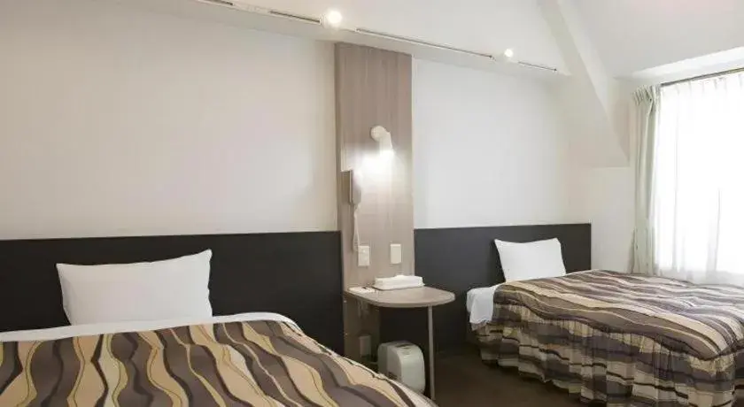 Bed in Hotel Tetora Tsurumi Bed in Hotel Tetora Tsurumi