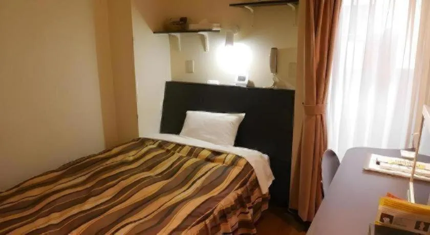 Bed in Hotel Tetora Tsurumi