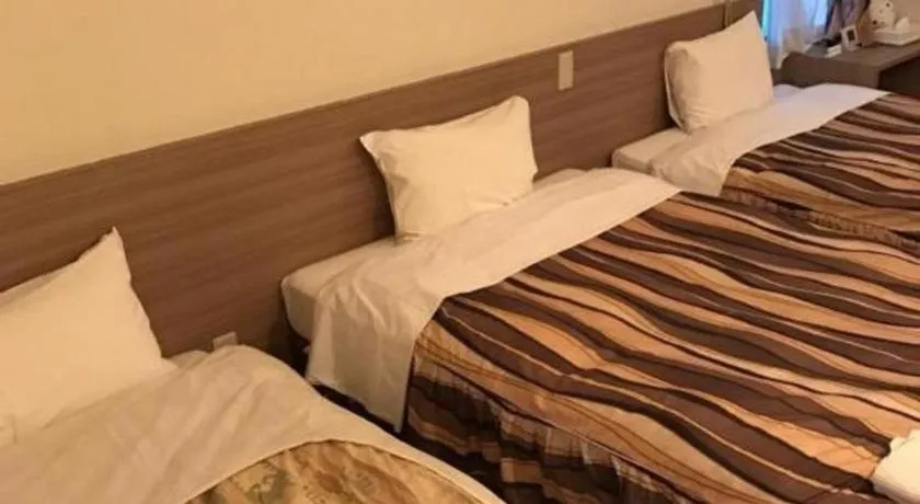 Bed in Hotel Tetora Tsurumi