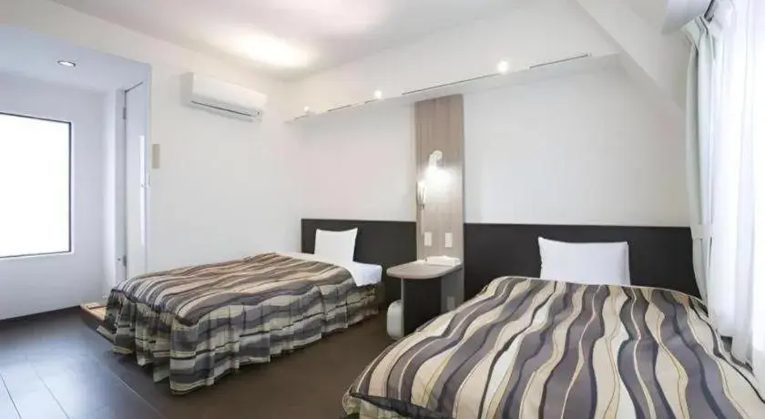 Bed in Hotel Tetora Tsurumi Bed in Hotel Tetora Tsurumi