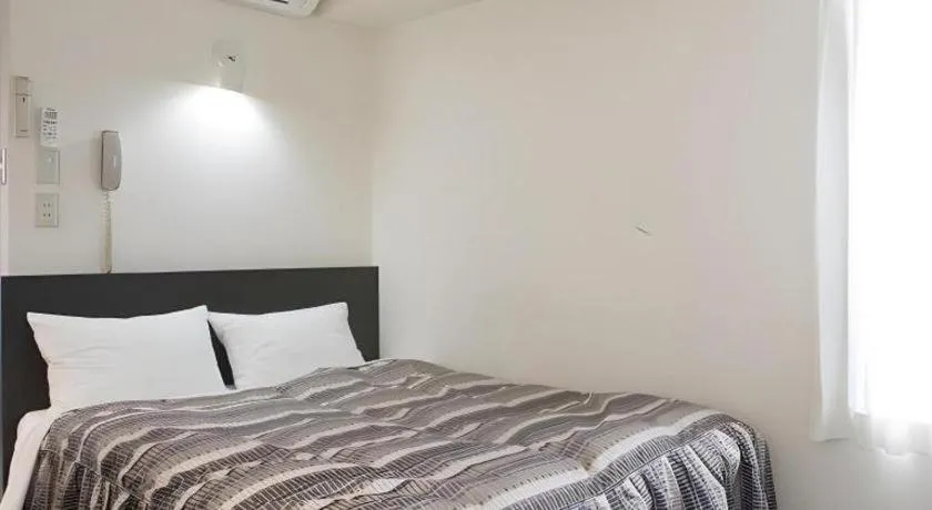 Bed in Hotel Tetora Tsurumi