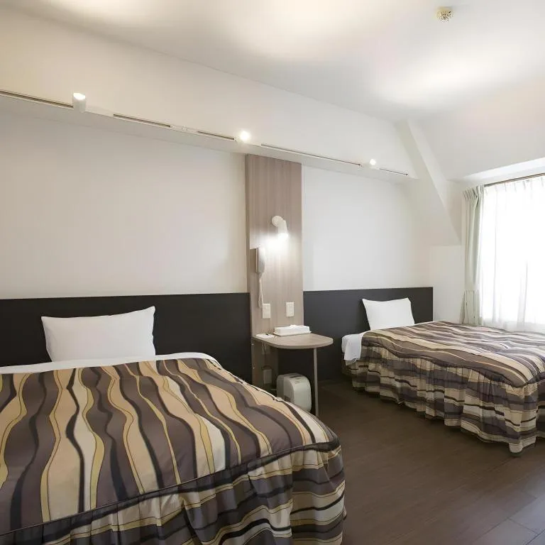 Bed in Hotel Tetora Tsurumi