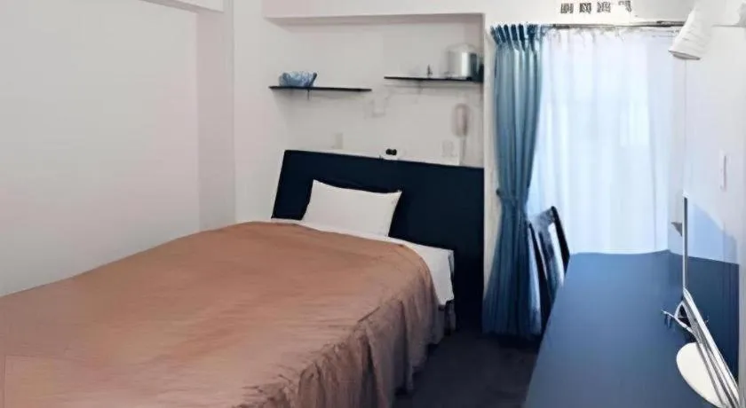 Bed in Hotel Tetora Tsurumi