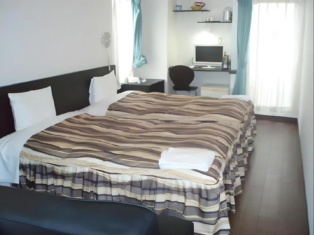 Bed in Hotel Tetora Tsurumi