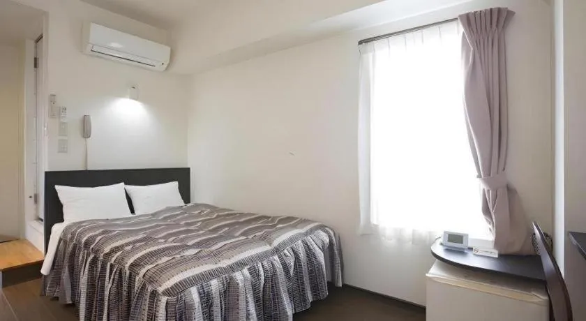 Bed in Hotel Tetora Tsurumi