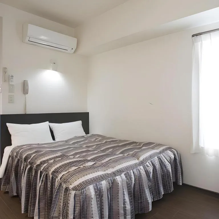 Bed in Hotel Tetora Tsurumi