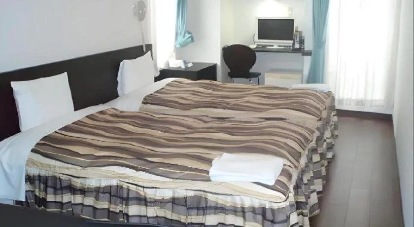 Bed in Hotel Tetora Tsurumi