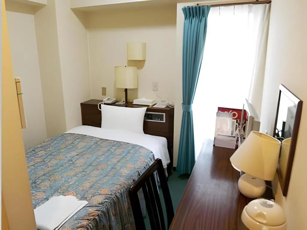 Bed in Hotel Tetora Tsurumi