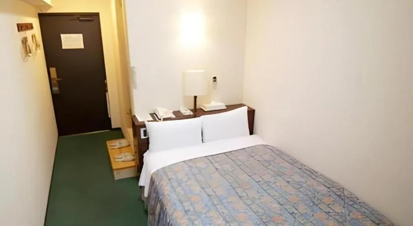 Bed in Hotel Tetora Tsurumi