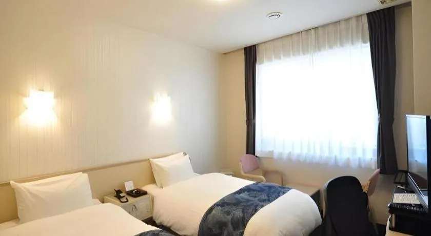 Bed in Hotel Obokekyo Mannaka