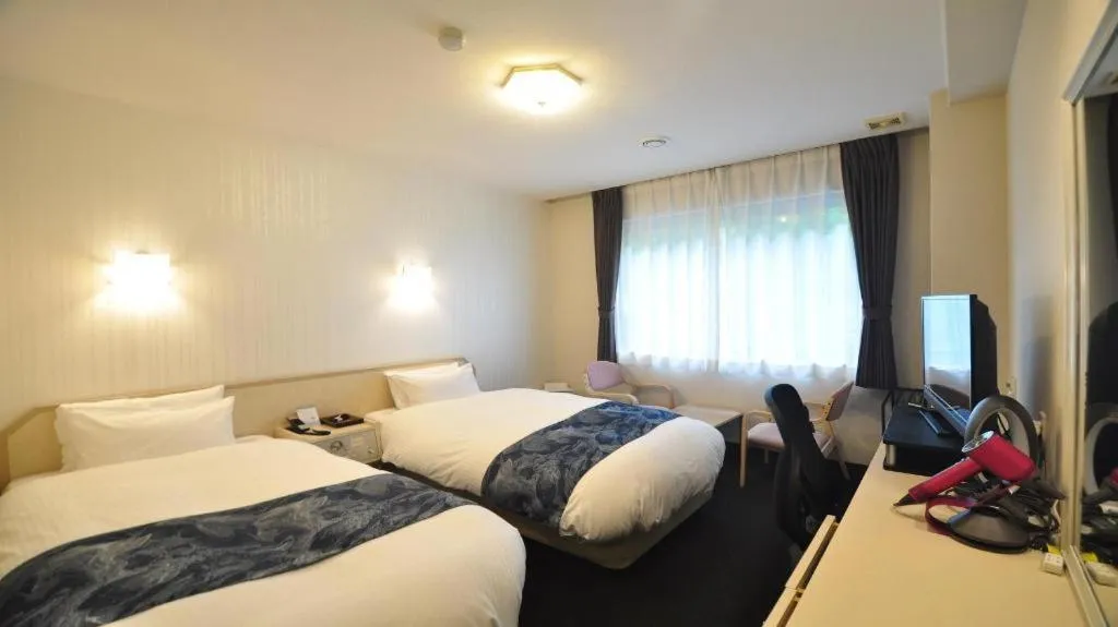 Bed in Hotel Obokekyo Mannaka