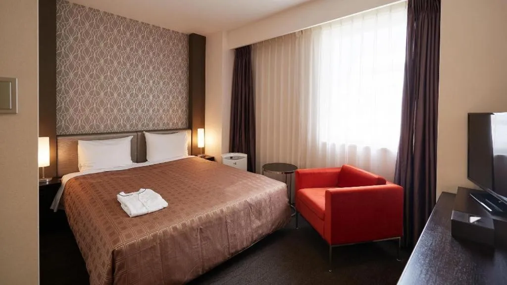 Bed in Hotel Yuquesta Asahibashi