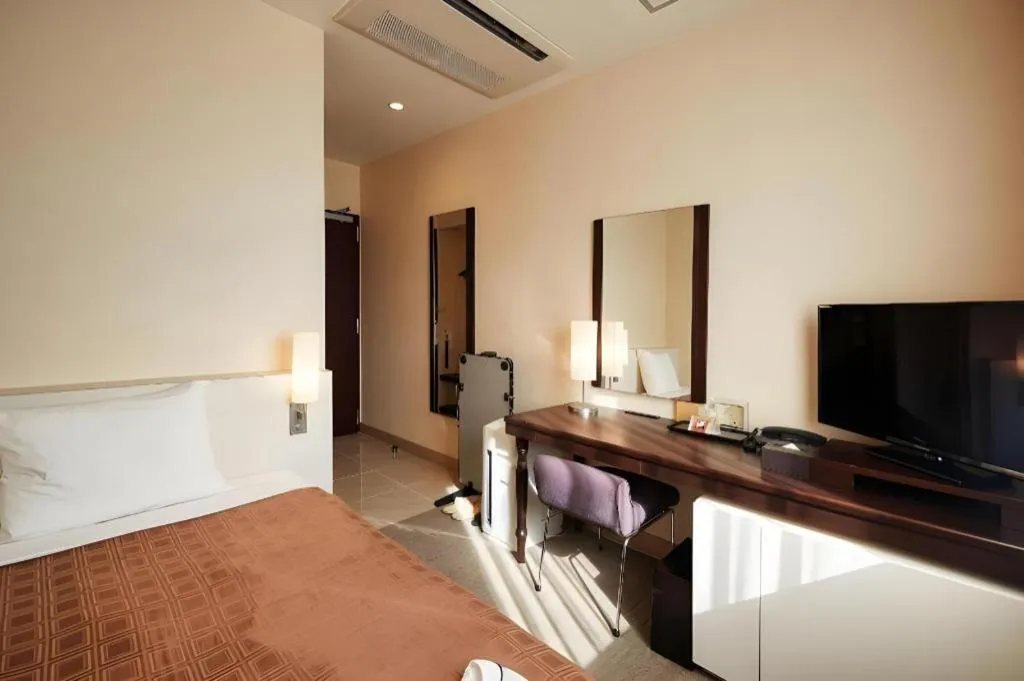 Bed in Hotel Yuquesta Asahibashi