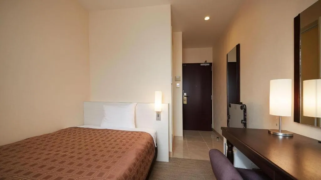 Bed in Hotel Yuquesta Asahibashi