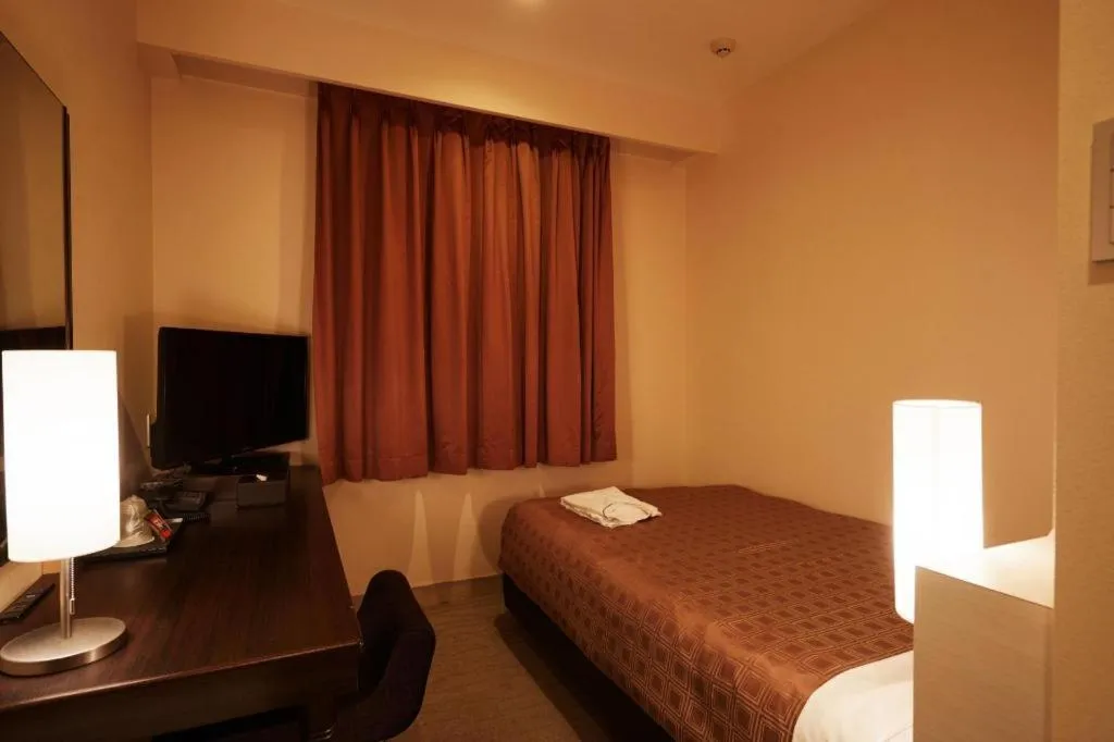 Bed in Hotel Yuquesta Asahibashi