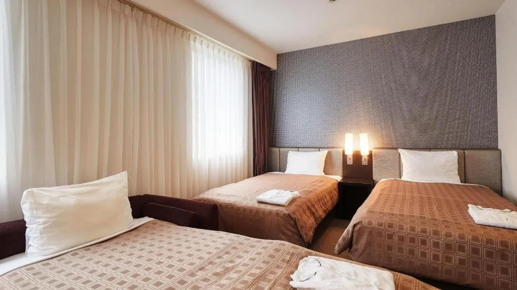 Bed in Hotel Yuquesta Asahibashi