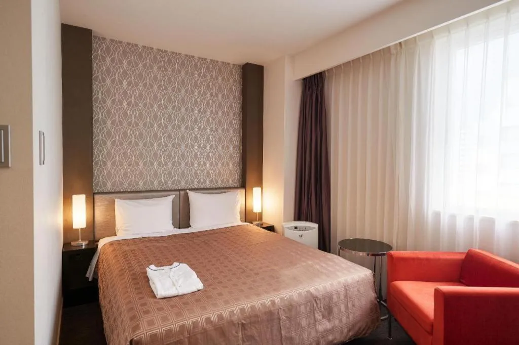 Bed in Hotel Yuquesta Asahibashi