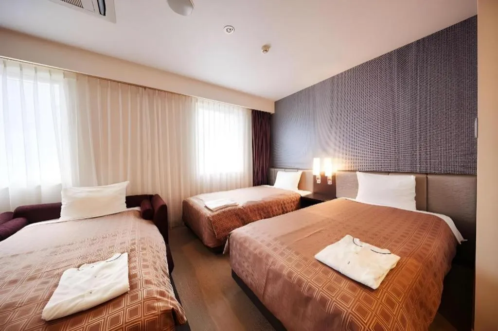 Bed in Hotel Yuquesta Asahibashi