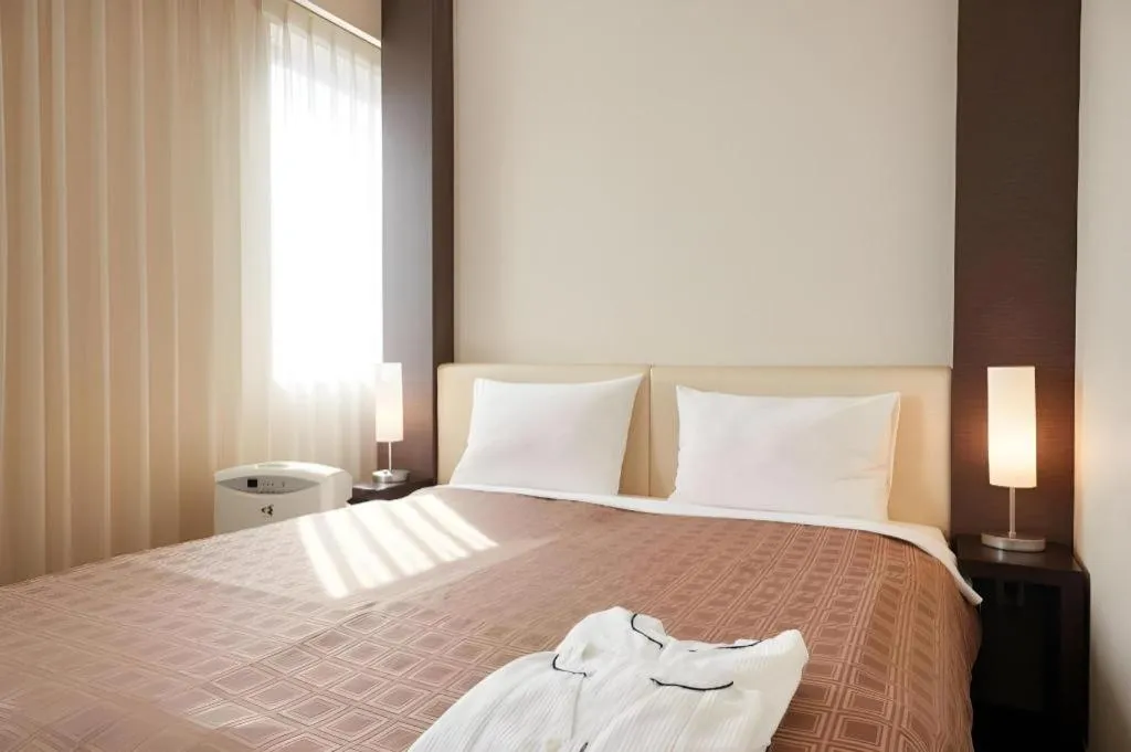 Bed in Hotel Yuquesta Asahibashi