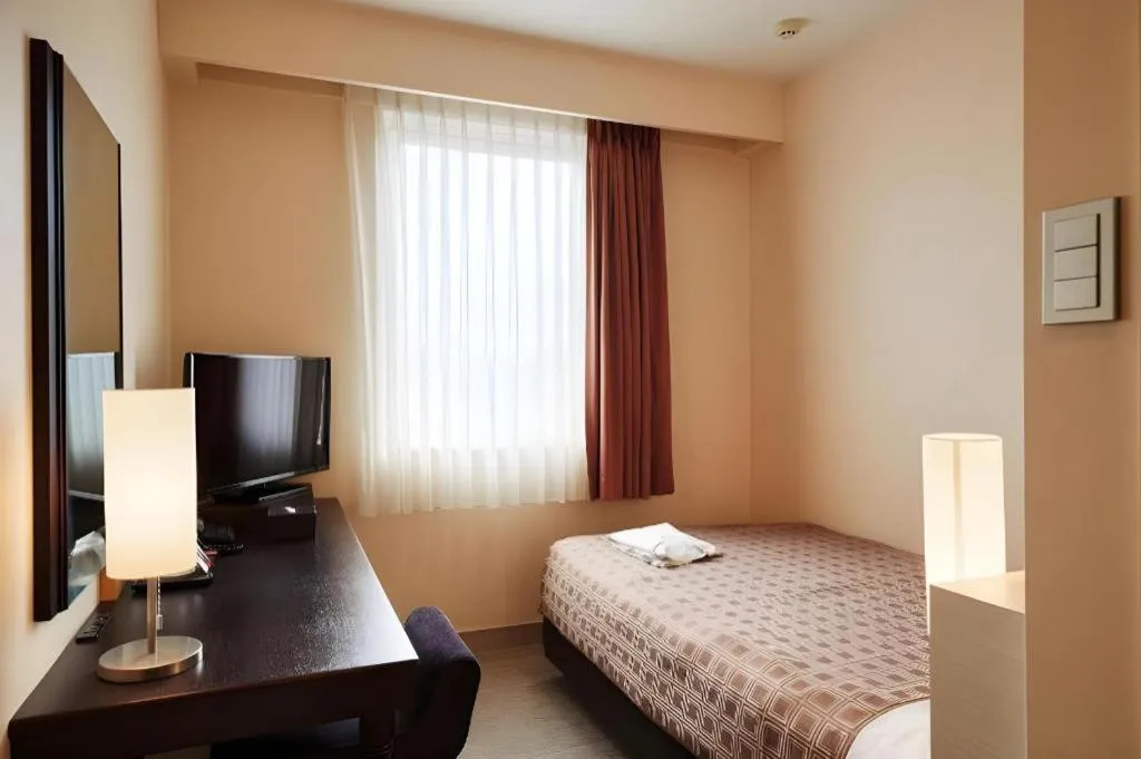 Bed in Hotel Yuquesta Asahibashi