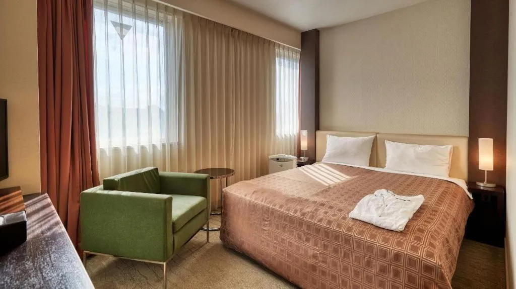 Bed in Hotel Yuquesta Asahibashi