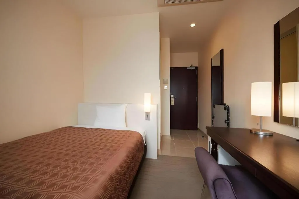 Bed in Hotel Yuquesta Asahibashi