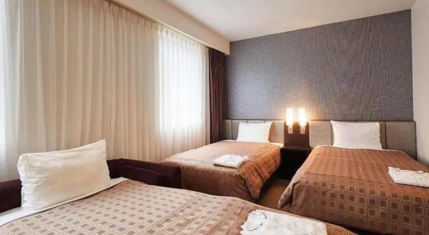 Bed in Hotel Yuquesta Asahibashi