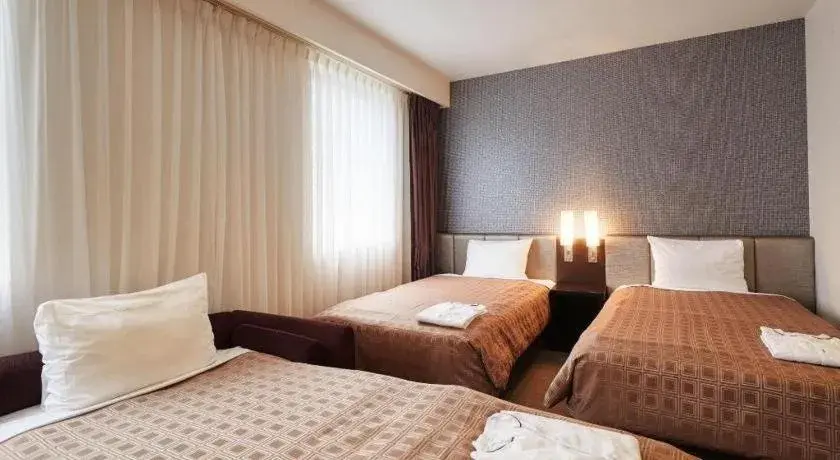 Bed in Hotel Yuquesta Asahibashi Bed in Hotel Yuquesta Asahibashi