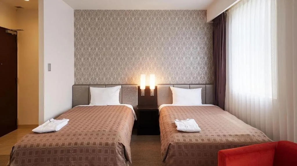 Bed in Hotel Yuquesta Asahibashi