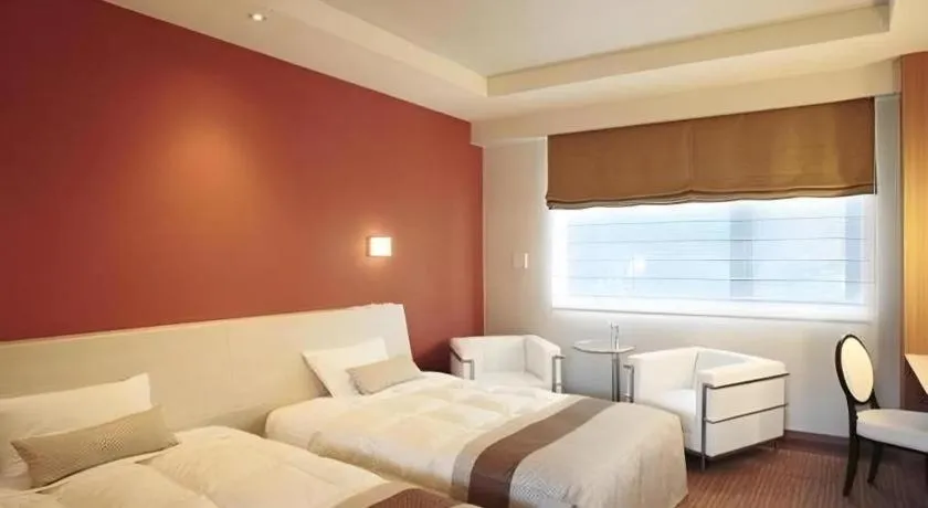 Bed in Sakuraan Kawaguchiko Hotel