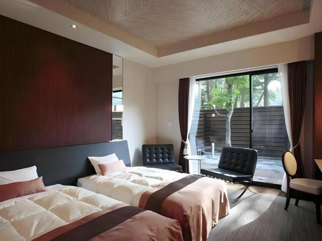 Bed in Sakuraan Kawaguchiko Hotel