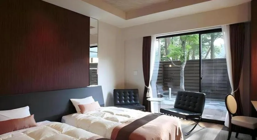 Bed in Sakuraan Kawaguchiko Hotel