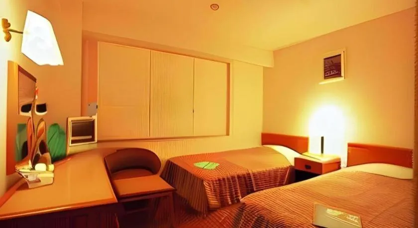 Bed in Mizue Dai-ichi Hotel