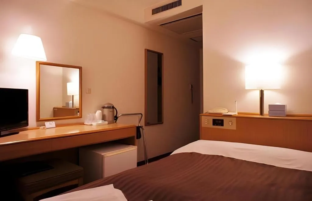 Bed in Mizue Dai-ichi Hotel