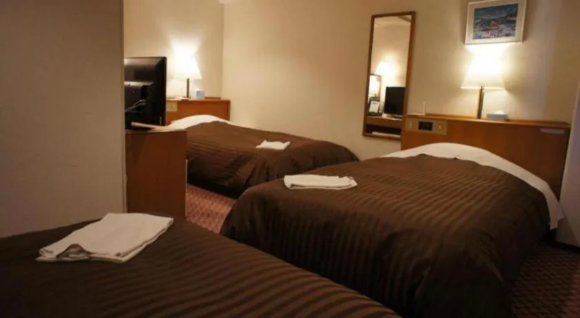 Bed in Mizue Dai-ichi Hotel