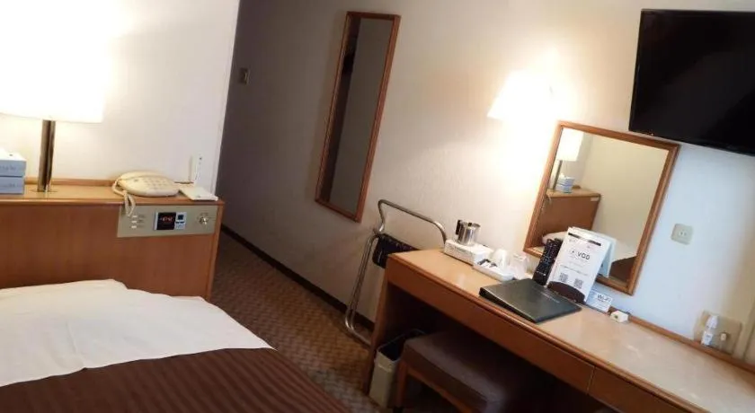 Bed in Mizue Dai-ichi Hotel