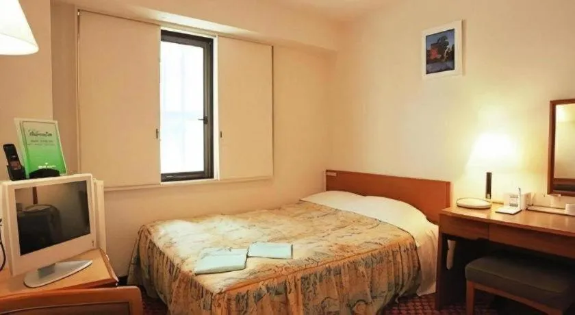 Bed in Mizue Dai-ichi Hotel