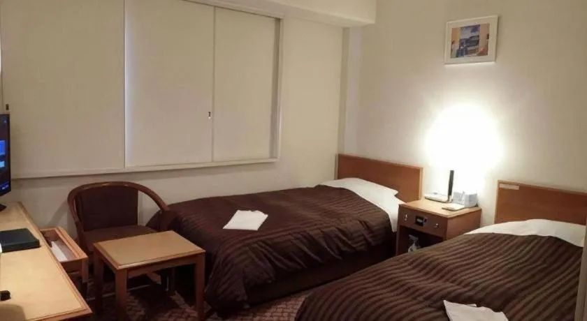 Bed in Mizue Dai-ichi Hotel